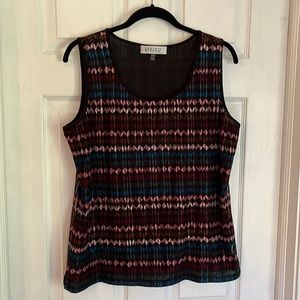 Sleeveless black zig zag design. Good condition